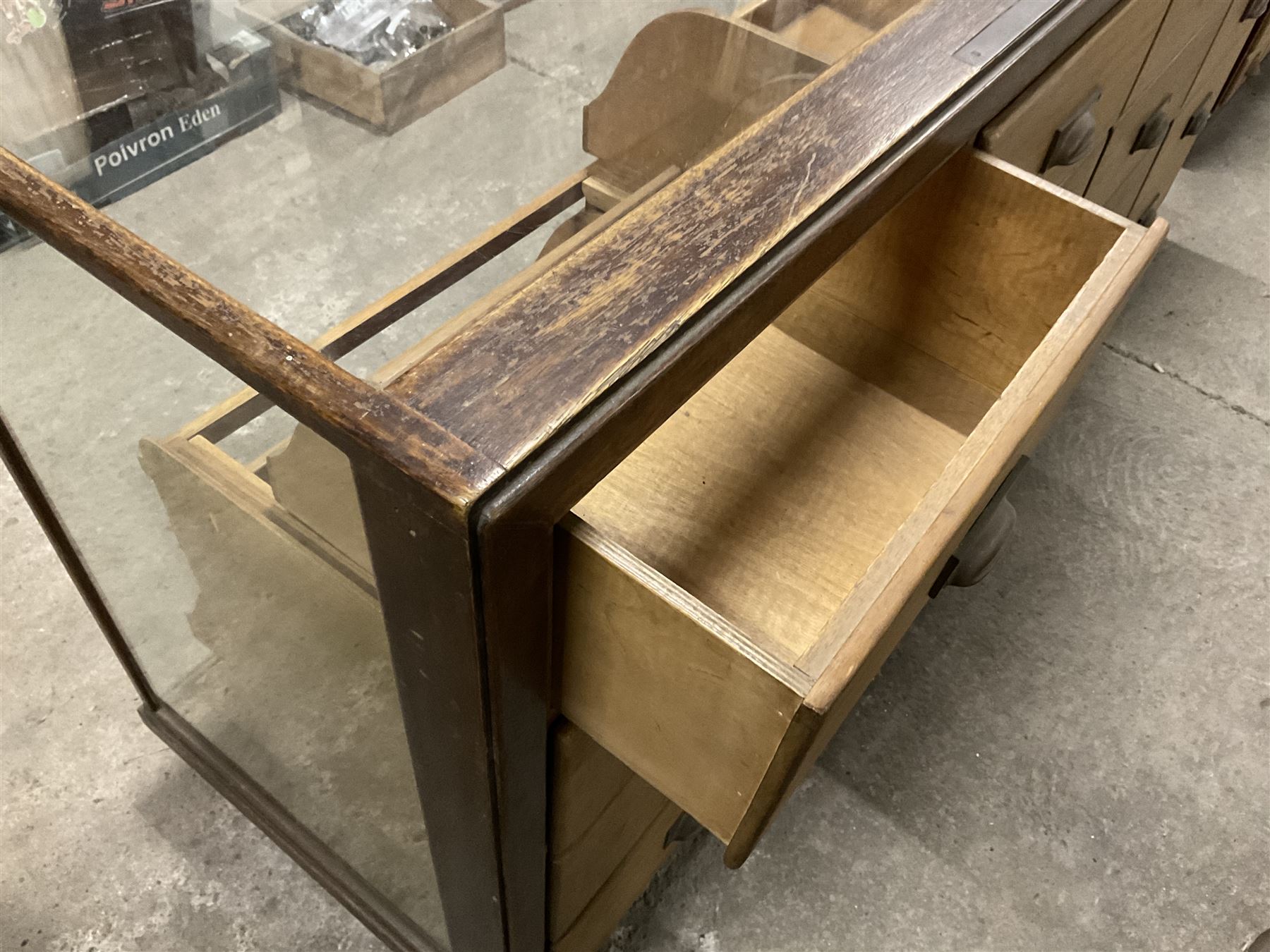 20th century oak and glazed haberdashery shop’s cabinet, glass front and sides, fitted with sixteen graduating drawers  - THIS LOT IS TO BE COLLECTED BY APPOINTMENT FROM THE OLD BUFFER DEPOT, MELBOURNE PLACE, SOWERBY, THIRSK, YO7 1QY