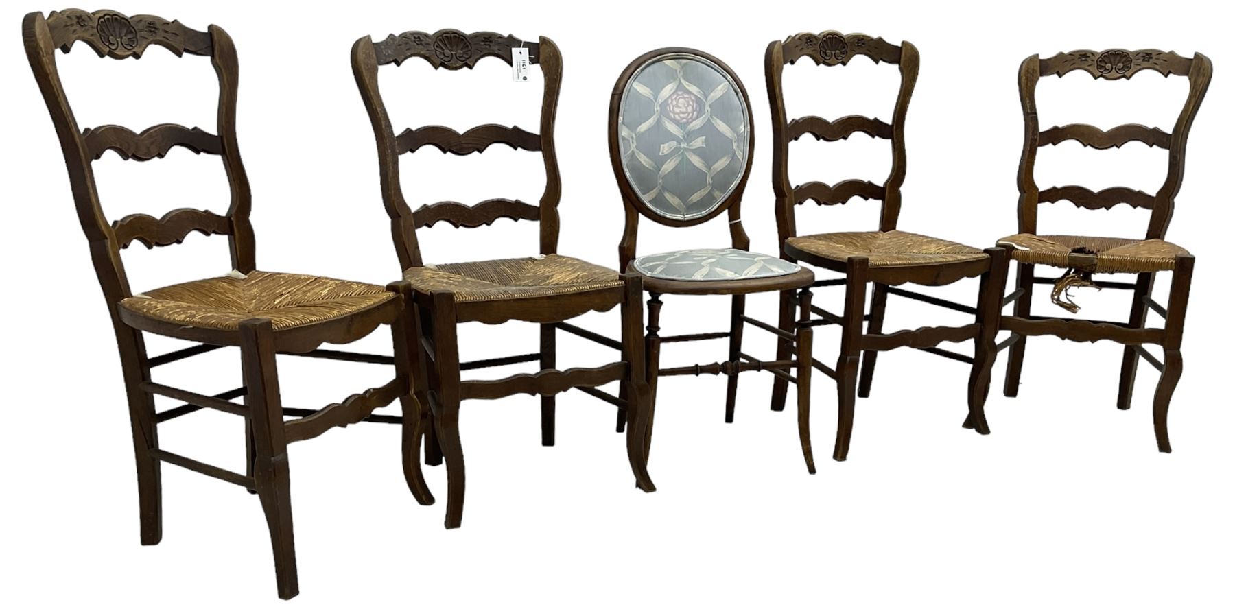 Set of four French hardwood dining chairs, the shaped cresting rail varved with shell, rush seat, on cabriole supports; Victorian beech cameo back chair 