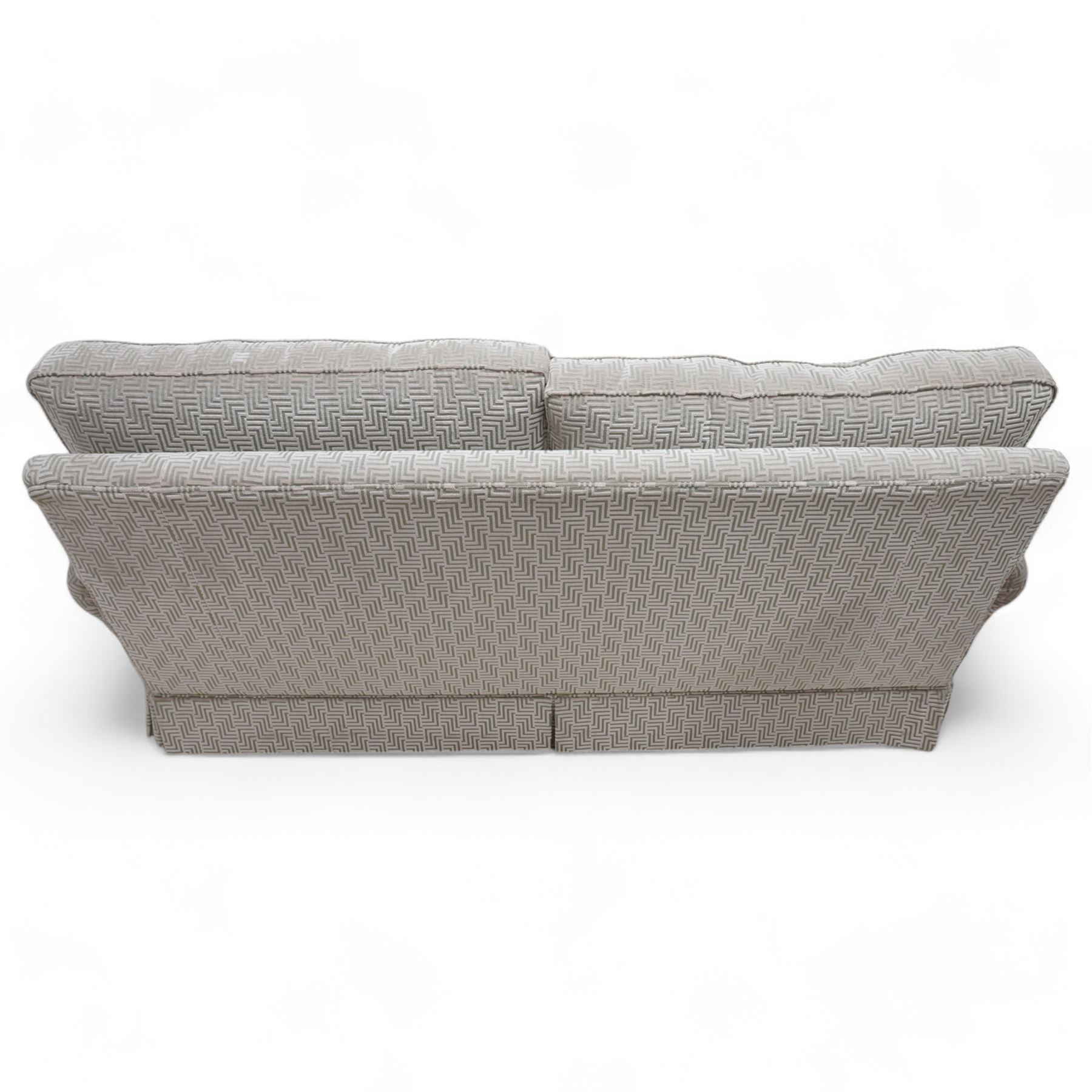 Duresta - traditional shape two seat sofa with rolled arms, upholstered in silvery-blue Greek key patterned fabric, with matching loose cushions, on castors