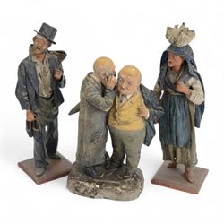 Two 19th century papier mache and wooden figures, together with a figure of two men in con...