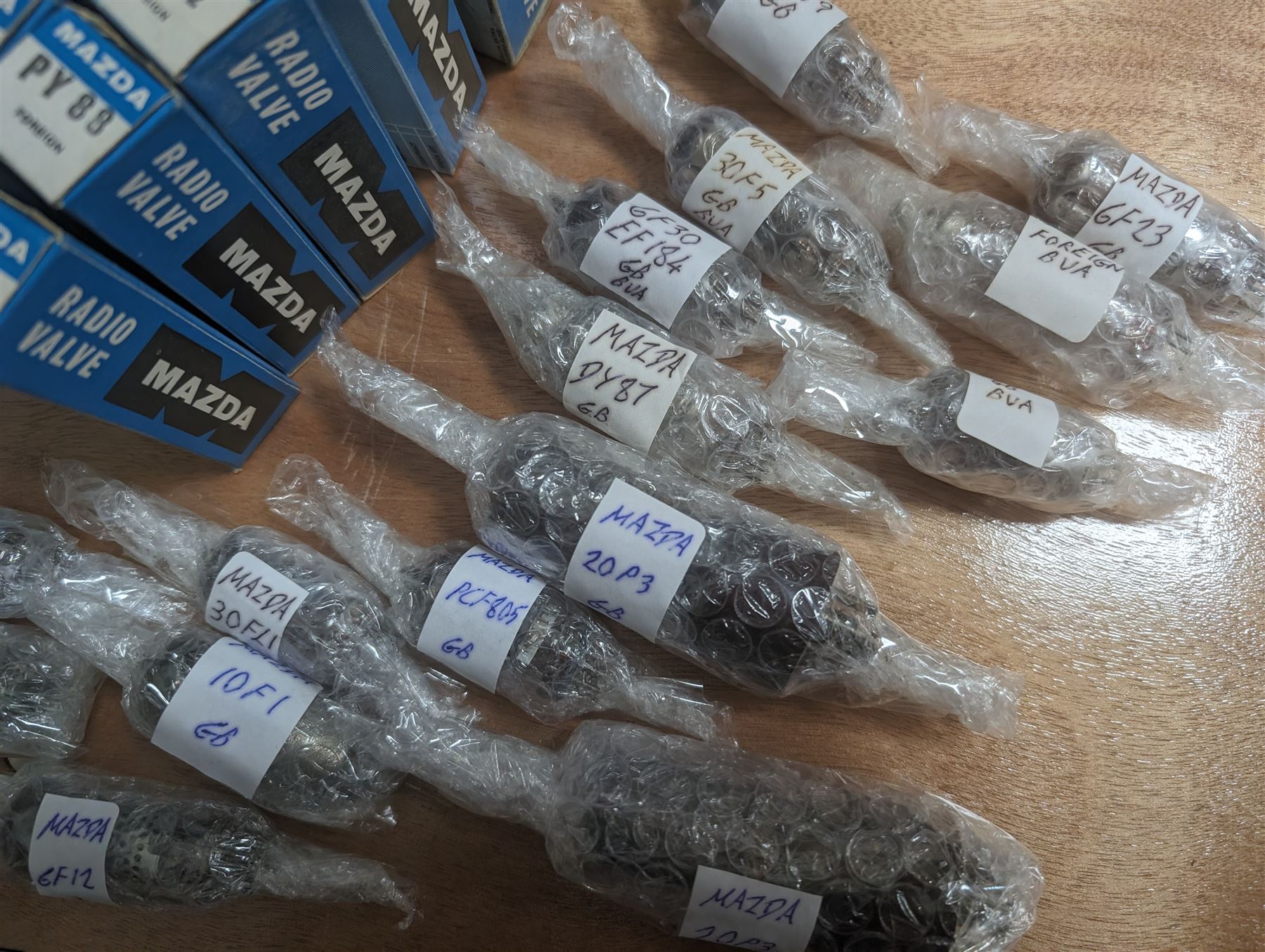 Large collection of Mazda thermionic radio valves/vacuum tubes, including boxed examples and loose bubble wrapped and identified examples