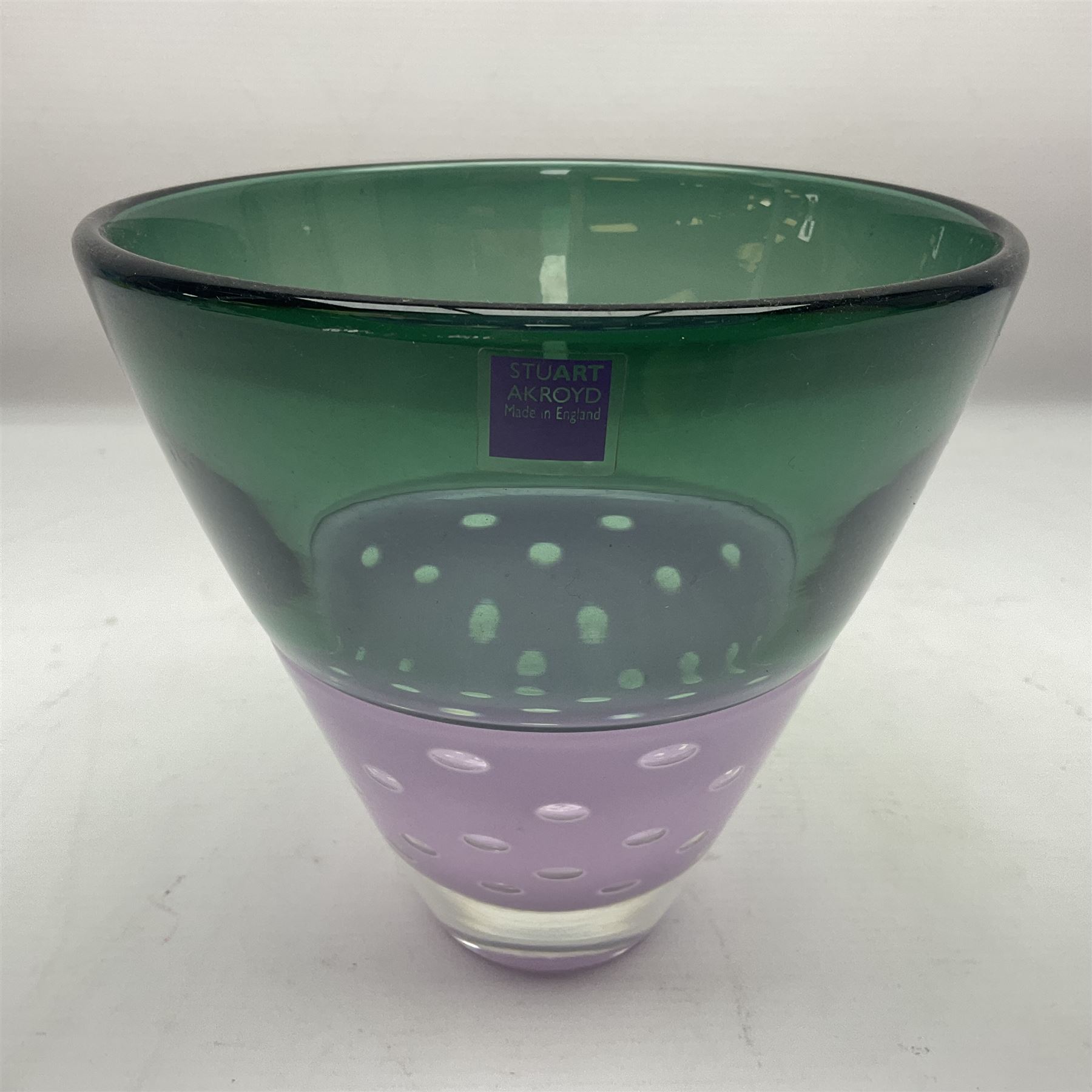 Stuart Akroyd glass vase, green banded top and purple opaque lower section with bubble inclusions, with sticker and engraved signature beneath, H15.5cm