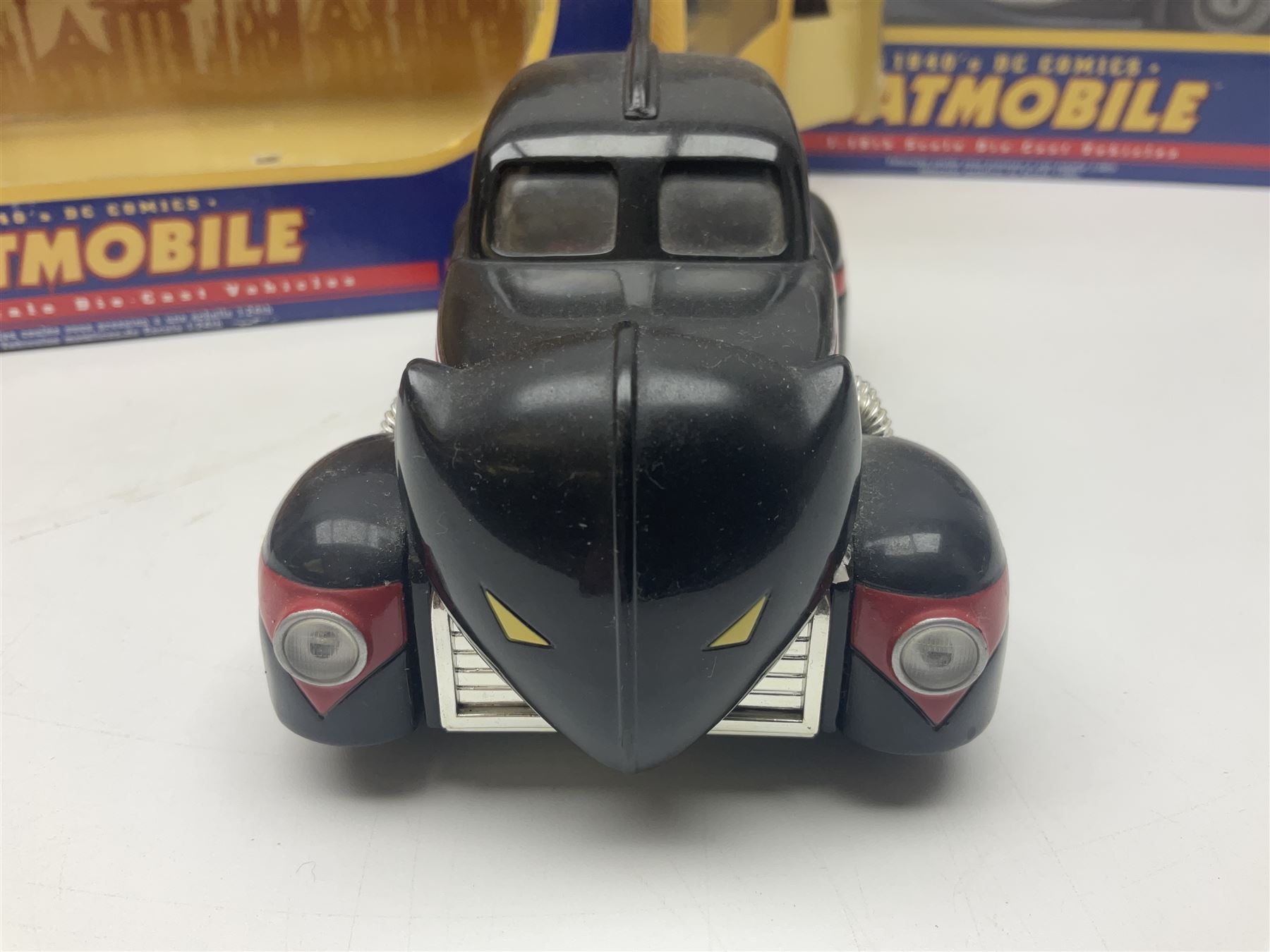 Five Corgi Batmobile die-cast vehicles from the DC Comics collection, to include 1940’s DC Comics BMBV2 1:18 and BMBV1 1:24 scale Batmobiles, all in original boxes 