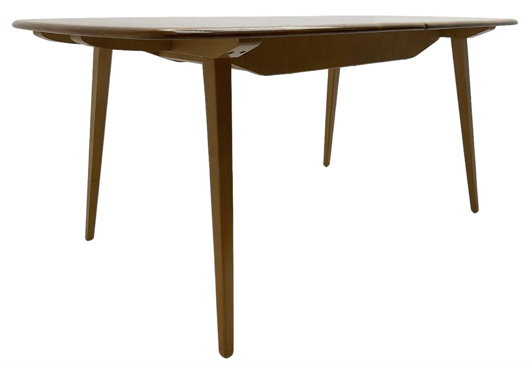 Ercol - light elm and beech 'Slide Leg Expanding Dining Table (444)', rectangular top with rounded corners, raised on tapered splayed supports, with two additional leaves