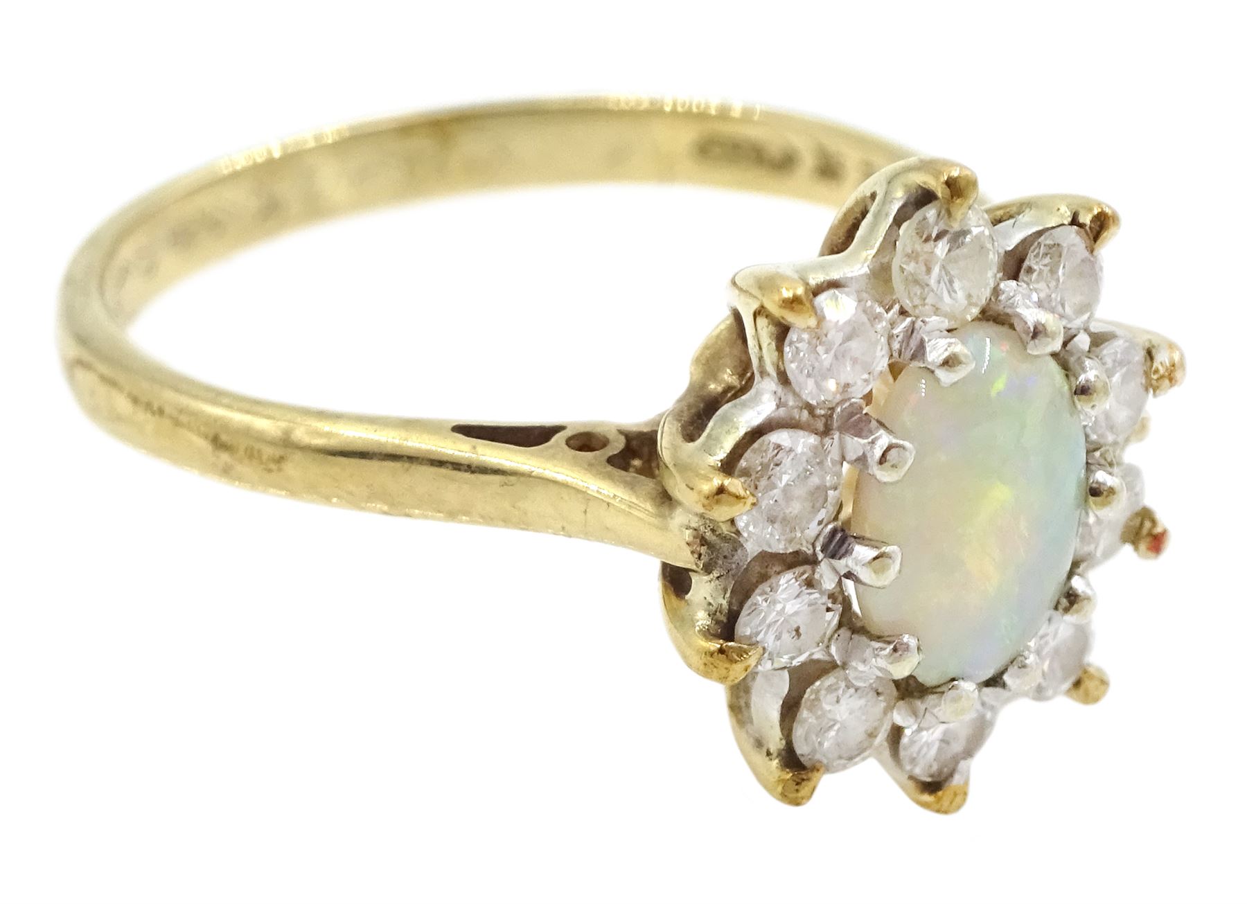 9ct gold oval opal and round brilliant cut diamond cluster ring, London 1982, total diamond weight approx 0.30 carat