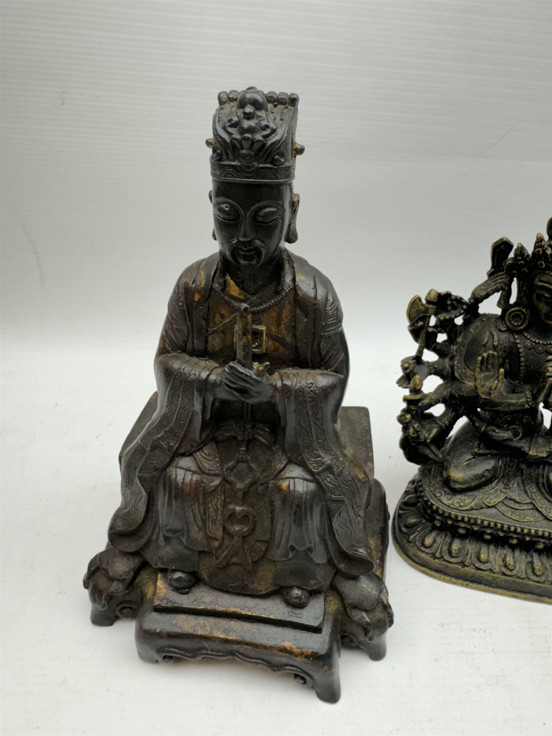 Chinese bronzed figure of Wenchang Wang (Wendi), with traces of gilt, together with Small brass Guanyin figure, largest H23cm