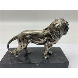 Silvered metal lion, upon a rectangular base, H12cm