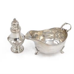 1930s silver pepper shaker, of urn shaped form with embrossed and engraved decoration, hal...