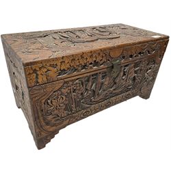 Chinese carved camphor wood blanked chest, rectangular hinged top, carved all over with traditional dragon motifs and junk ships