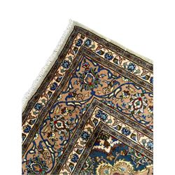 Persian Kashmar pale green ground rug, shaped central medallion decorated with stylised flower heads, the surrounding field with scrolling leafy branches and palmettes, the spandrels and border decorated with further palettes, within floral pattern guard stripes