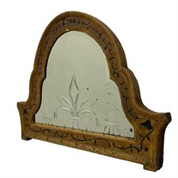 19th century painted pine and gesso wall mirror, stepped arch frame enclosing mirror plate with bevelled stylised leaf decoration and bevelled edge, the frame carved with scrolling leafy branches and painted with black detail, foliate moulded outer edge