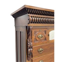 Late Victorian walnut Scotch chest, projecting cornice with turned quarter column mounts over matching half column to frieze, fitted with two upper short drawers with central cupboard, bevelled mirror glazed cupboard door, four graduating drawers below, foliage and flower head carved brackets to the uprights, panelled sides, chamfered plinth on turned feet