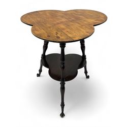 Late 19th to early 20th century stained beech 'Gypsy' table, trefoil or clover shaped top on turned supports united by undertier, on cast metal and glass ball feet 