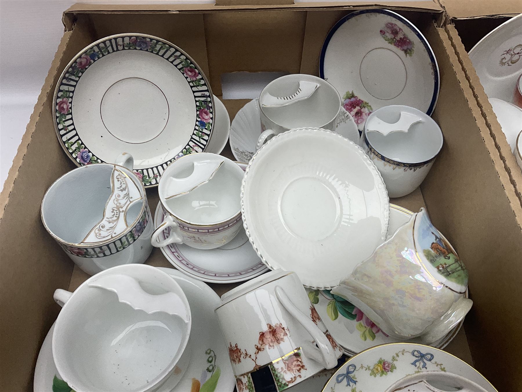 Collection of 19th century and later moustache cups, mostly with matching saucers, including hand painted examples