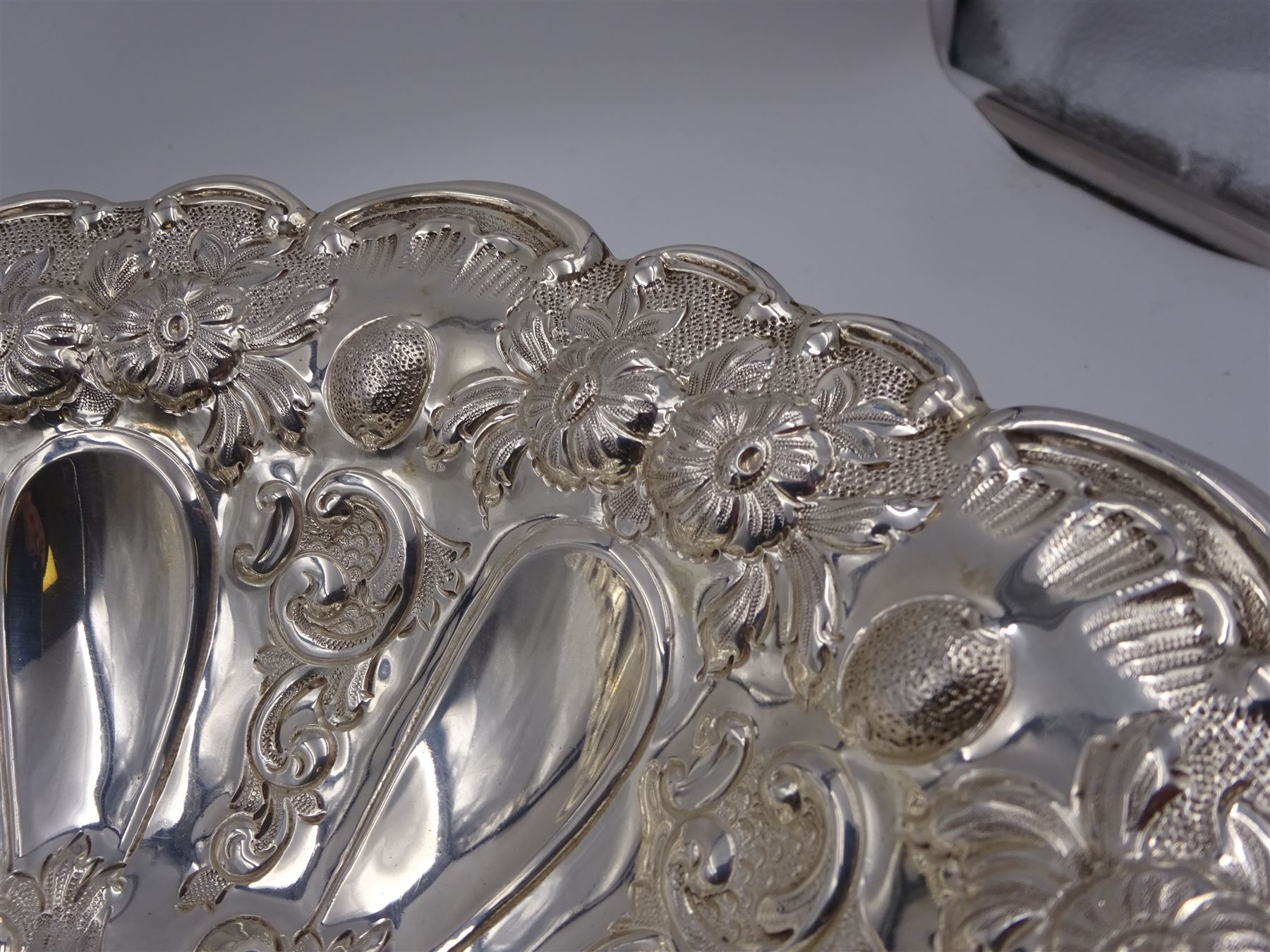 Edwardian silver pedestal bowl, of circular form, with shaped C scroll rim, embossed with floral and foliate decoration throughout, upon a circular foot, hallmarked Elkington & Co Ltd, Birmingham 1901, H9.5cm, D25cm