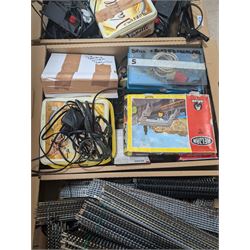 Collection of model railway accessories, including OO gauge track, control units etc, in four boxes 