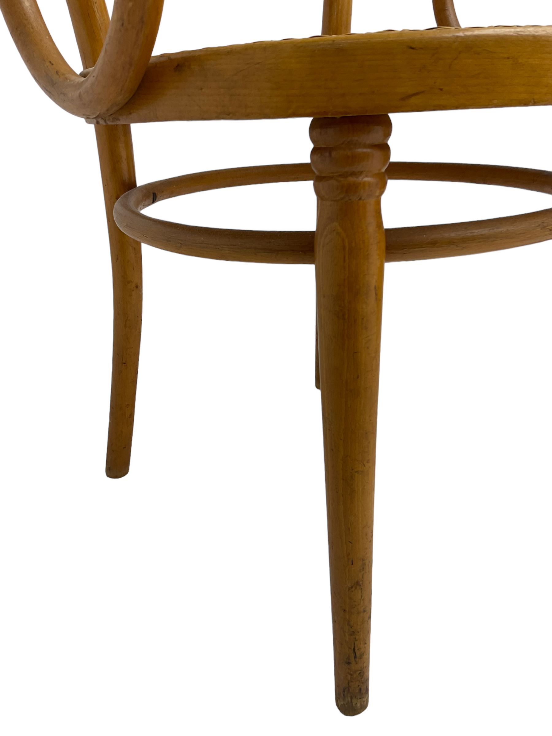 After Michael Thonet - bentwood armchair, circular cane seat and back, scrolled arms