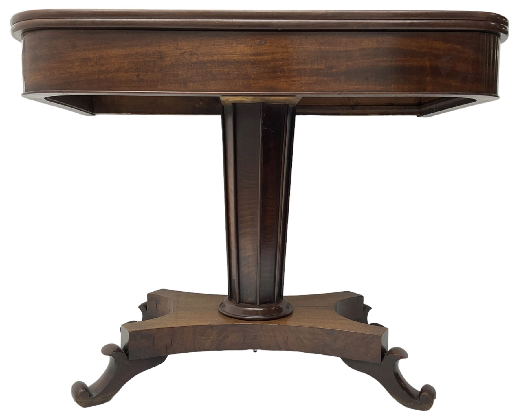 William IV mahogany tea table, rectangular fold-over top over banded frieze, tapering pedestal base with moulded vertical rails, on quadruform base with C-scroll feet