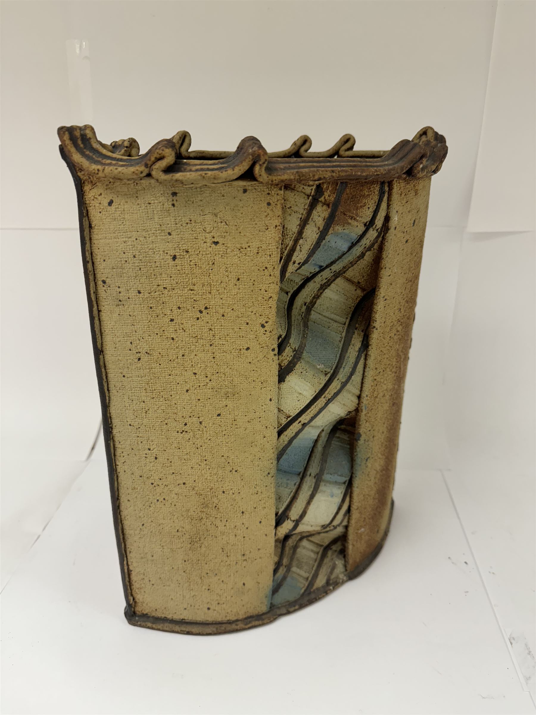 Jim Robison (American 1939-): slab built sculptural stoneware vase, of navette form with textured fabric effect decoration to centre, signed beneath, H35cm