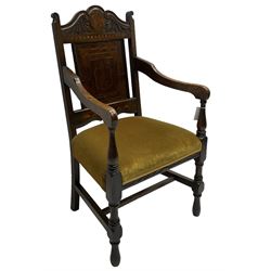 Late 19th to early 20th century oak elbow chair, the shaped cresting rail carved with scrolls and foliage, panelled back inlaid with parquetry work and central rampant lion within shield, upholstered seat, on turned supports joined by H stretchers