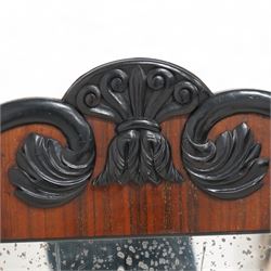 Early 19th century rosewood and ebonised overmantel mirror, scroll shaped pediment decorated with ebonised acanthus carved applied mounts, rib turned upright mounts enclosing rectangular mercury mirror plate, applied lower beaded edge 