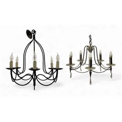 Contemporary black wrought iron six-light chandelier with drip trays and faux candle sleev...