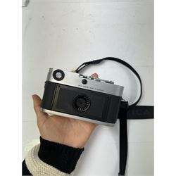 Leica MP 0.72 35mm film rangefinder camera body, in silver, chrome and black small grain leatherette finish, serial no. 2923784, made in Germany circa 2003, with Leica shoulder strap