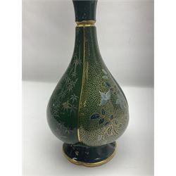 Royal Worcester vase of baluster form with floral decoration on a green ground H26cm