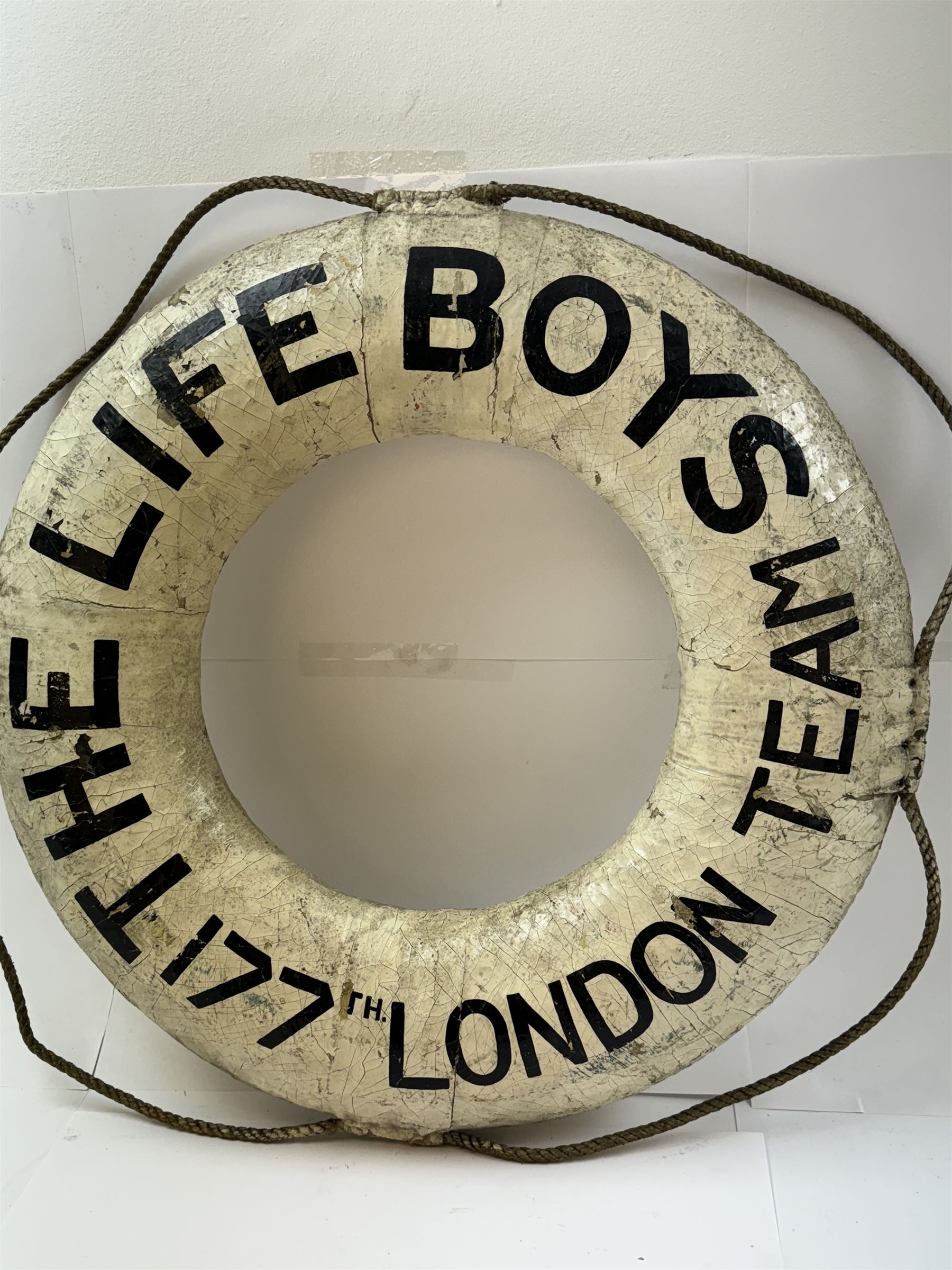 Early 20th century lifebuoy, painted in black lettering 'The Life Boys 177th London Team' upon a white ground, D53cm