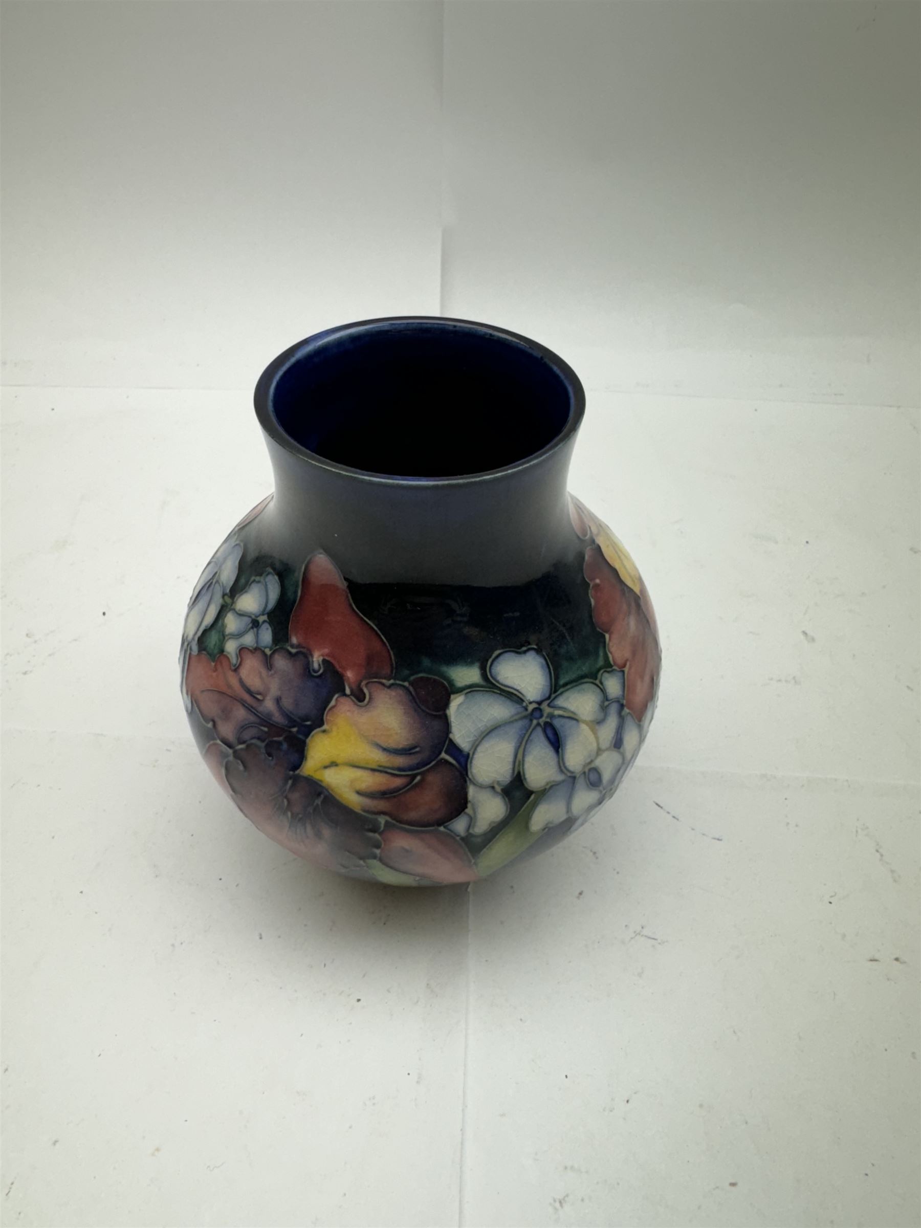 Moorcroft vase of squat baluster form in Orchid pattern H14cm