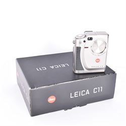 Leica C11 APS film compact camera, in silver and chrome finish, serial no. 2636834, in original clear hard case and box, with instruction booklet, together with a Leica Digilux 4.3, with 1:2.8-4.5/8.3-24.9mm lens, serial no. 2598862, with instruction booklet