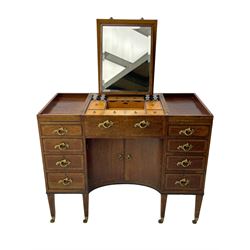 Late 19th century mahogany and satinwood dressing chest, the raised middle section hinges to reveal an interior fitted with lidded compartments, removable tray, single drawer and glass scent bottles, lift-up bevelled mirror with adjustable hinged mechanism, fitted with a further eight cock-beaded graduating drawers and curved kneehole with double cupboard, square tapering supports on brass cups and castors, inlaid throughout with checkered stringing, ornate Rococo cast gilt metal handles