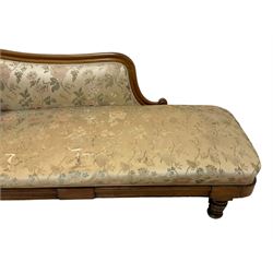 Victorian rosewood chaise longue, rolled back rest and shaped cresting rail carved with curled leaves and scrolls, upholstered in floral pattern fabric with bolster cushion, moulded lower rail with rectangular panel, on turned and lappet carved feet