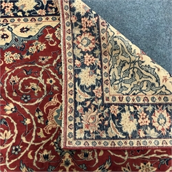 Keshan red ground rug, central medallion, repeating border, 314cm x 216cm