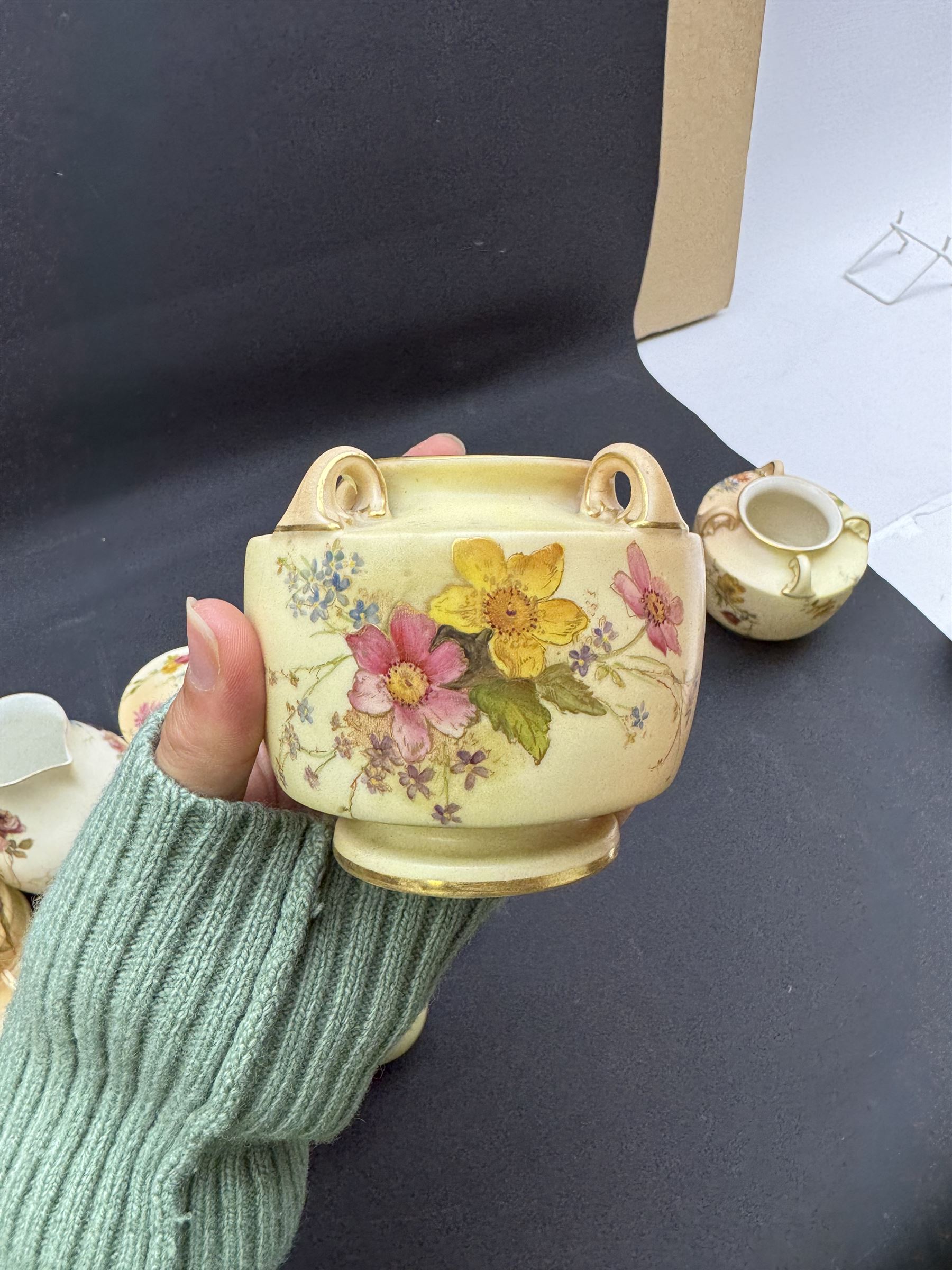 Collection of Royal Worcester blush ivory ceramics, including a graduating set of posey baskets, miniature flatback jug, covered jars etc (19) 