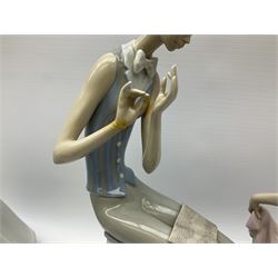 Collection of seven Lladro figures, including Seated ballerina with swan 6204, Childhood Dream 8129, Dancer 5050, reclining clown with ball alongside a selection of other figures. 