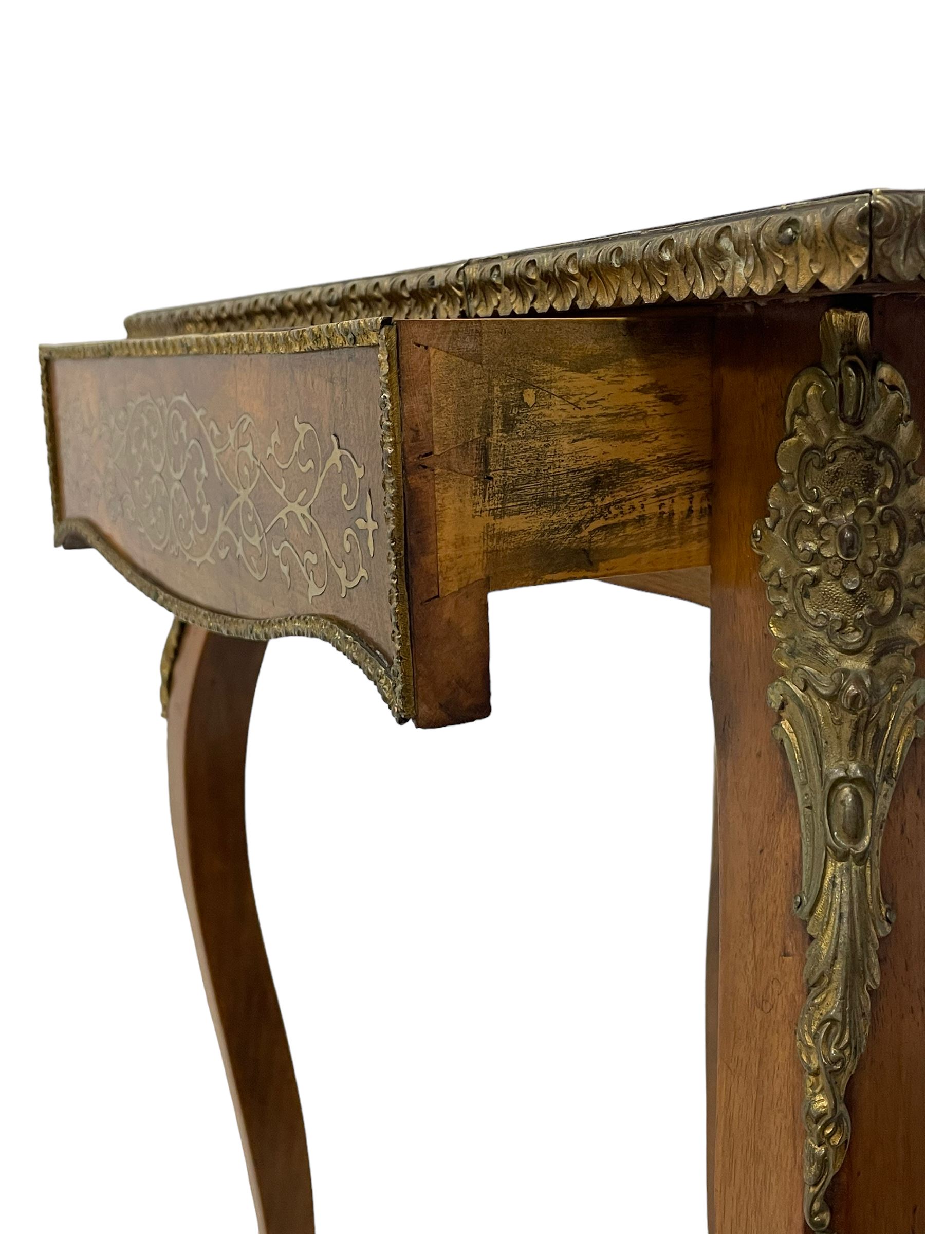 In the manner of Émile Gallé - late 19th to early 20th century inlaid walnut side table, rectangular top inlaid with Japonisme decoration depicting birds within trees, figured crossbanding and cast gilt foliate applied edge, single frieze drawer inlaid with scrolling brass work, on cabriole supports with ornate floral mounts