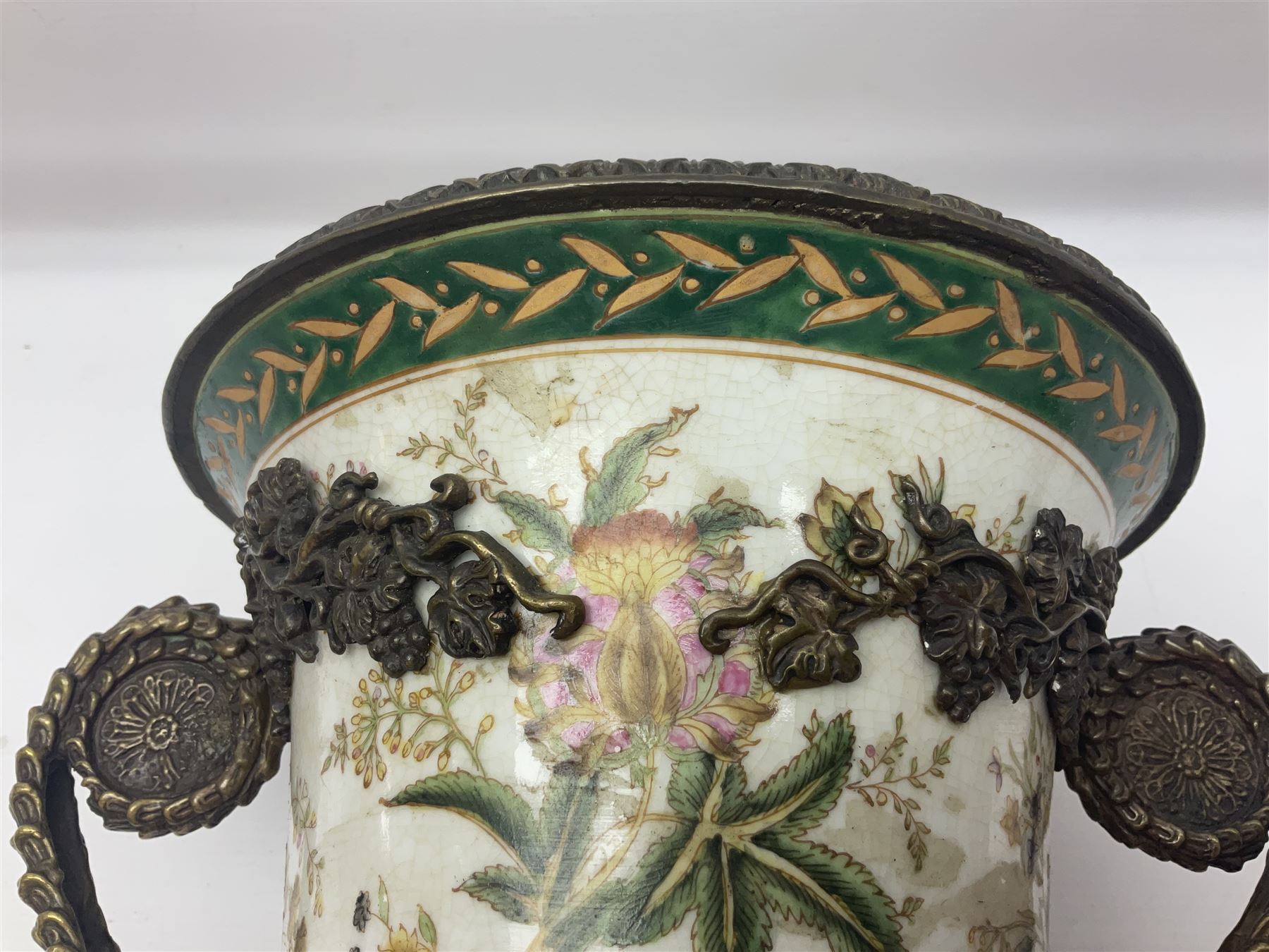 Wong Lee, twin handled ceramic urn with enamelled floral decoration and bronzed metal mounts, marked to base, height 33cm