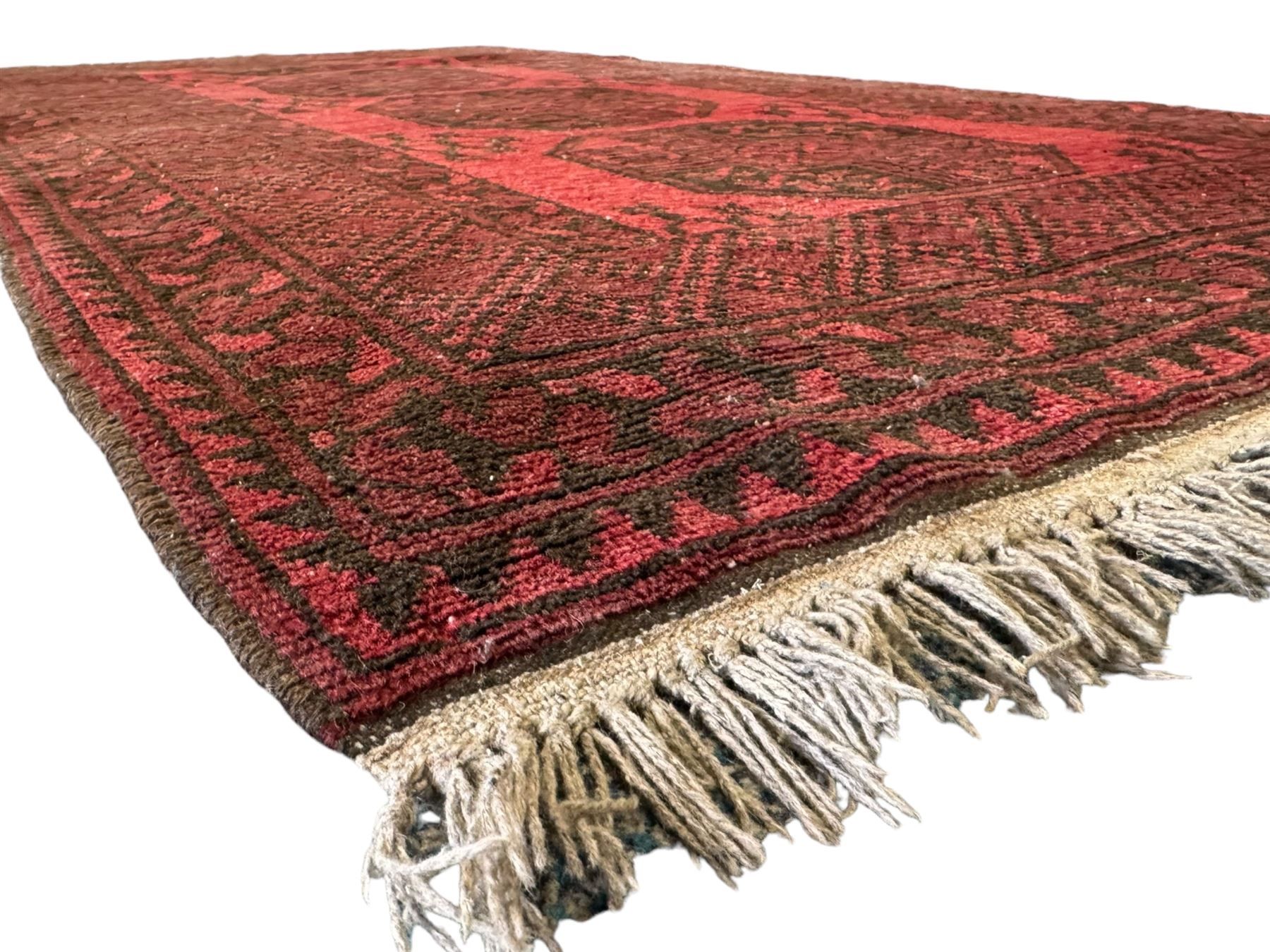 Afghan red ground Bokhara rug, decorated with four central Gul motifs, enclosed by wide geometric guard bands (191cm x 104cm); together with another similar (120cm x 79cm)