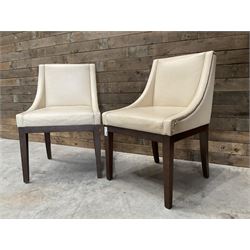 28 x walnut framed dining chairs, upholstered in beige leather