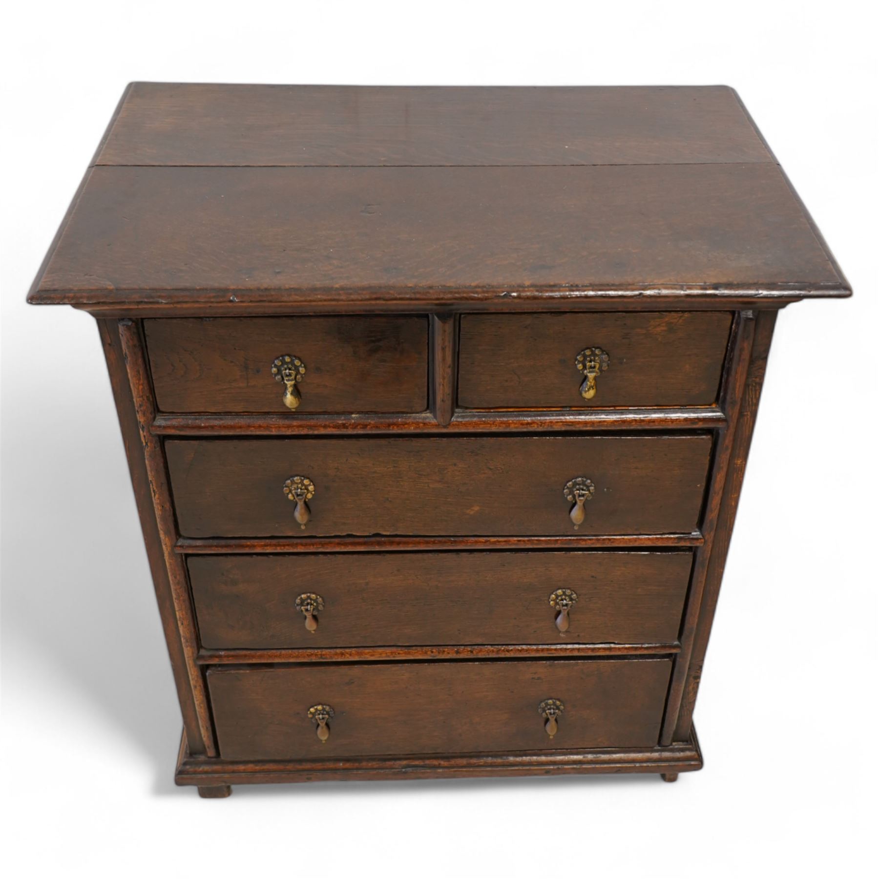 18th century oak chest, moulded rectangular top over two short over three long drawers, beaded circular handle plates and drop handles, on stile supports 