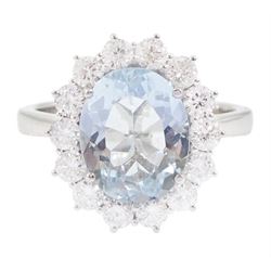 18ct white gold oval cut aquamarine and round brilliant cut diamond cluster ring, hallmarked, aquamarine approx 2.55 carat, total diamond weight approx 0.80 carat