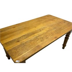 Limed oak dining table, rectangular top with rounded corners, on turned supports