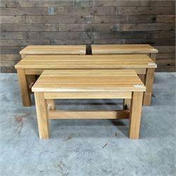 Three small light oak benches and a large bench