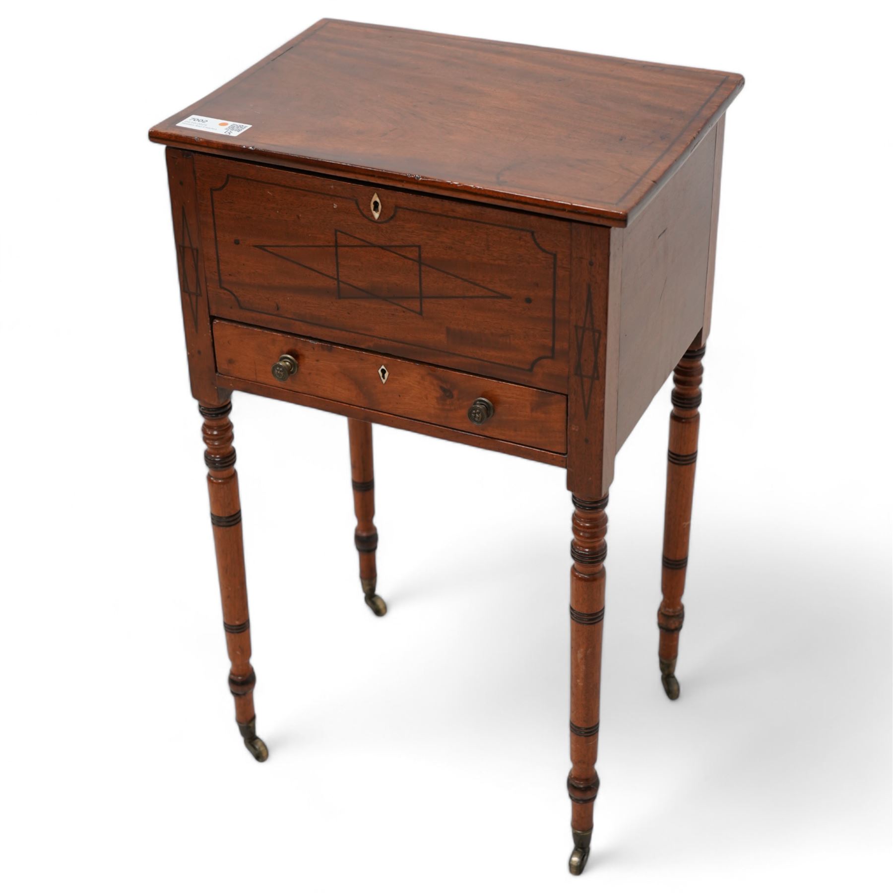 George III mahogany work table, rectangular hinged top enclosing upholstered interior, fitted with single drawer, the front inlaid with geometric stringing, on ring turned supports with brass cups and castors  