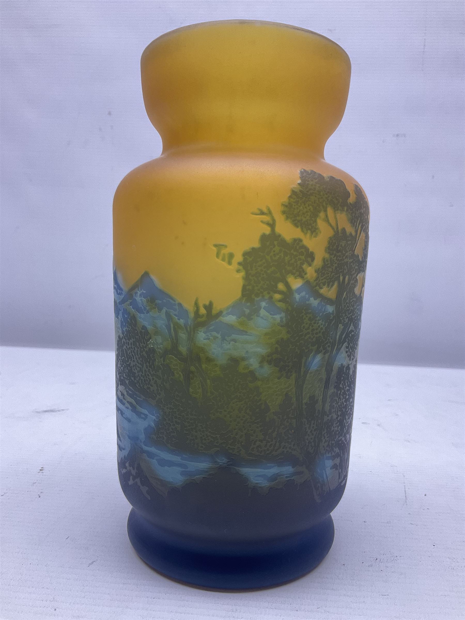 Art Nouveau style glass vase, in the style of Galle,the body decorated with woodland and mountain scene, upon a yellow ground, H20cm 