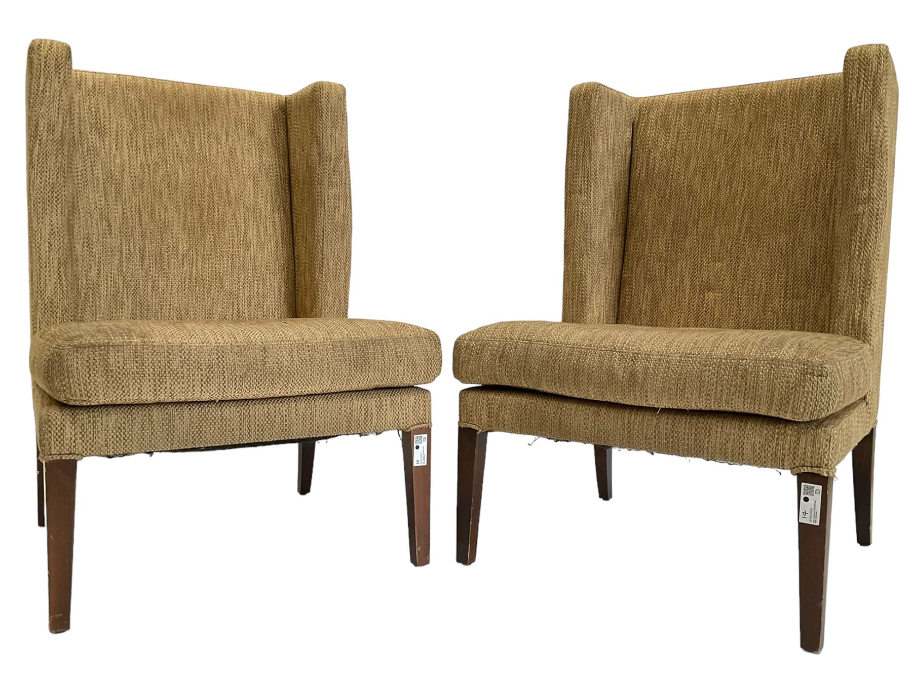 Two wing back armchairs, upholstered in oatmeal fabric