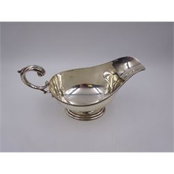 1930s silver sauce boat, of typical form, with oblique gadrooned rim and acanthus capped flying C scroll handle, by William Hutton & Sons Ltd, Sheffield 1934, H11cm