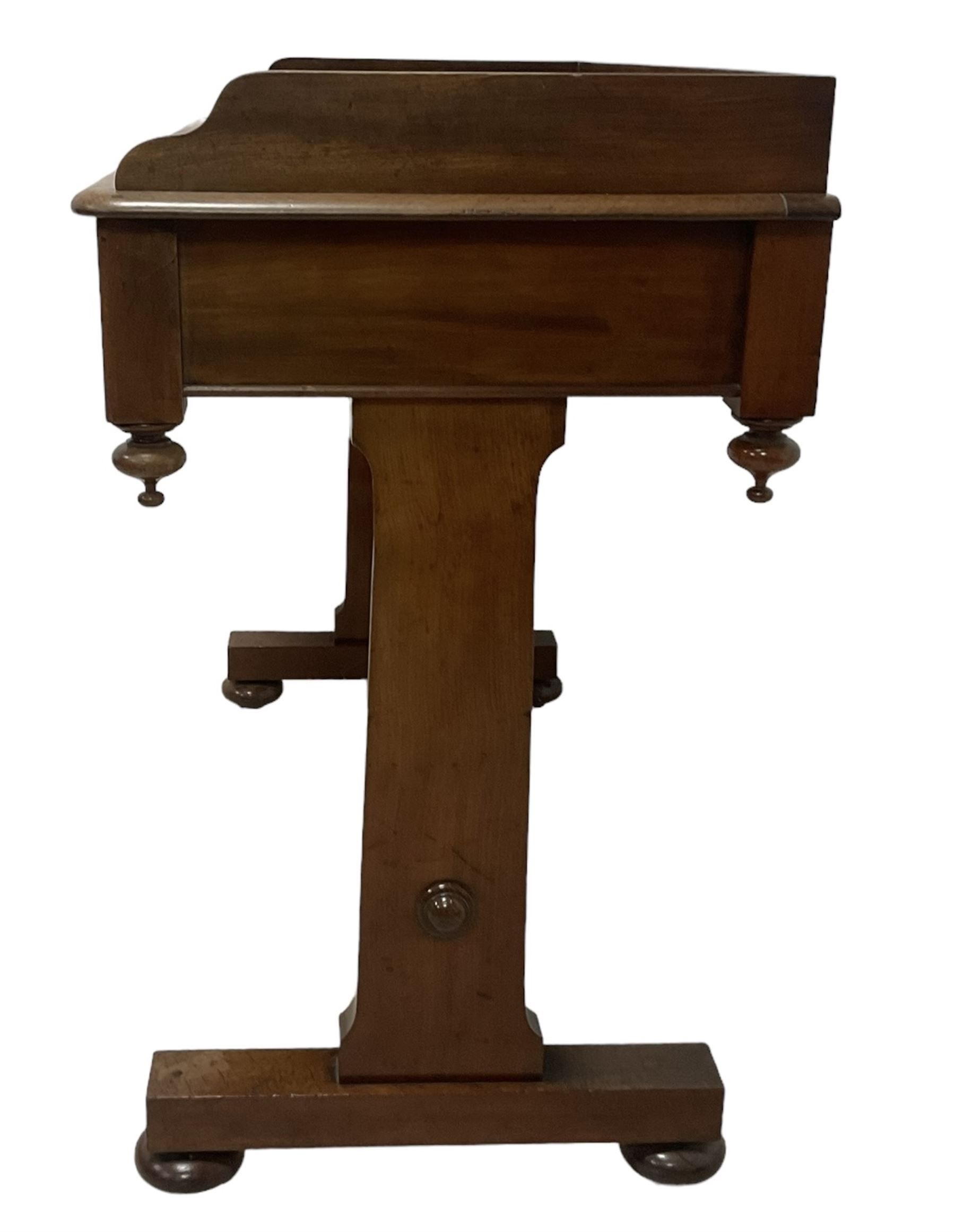 Victorian mahogany washstand, three-quarter raised gallery back, rectangular top with over two drawers, on shaped end supports united by ring-turned stretcher