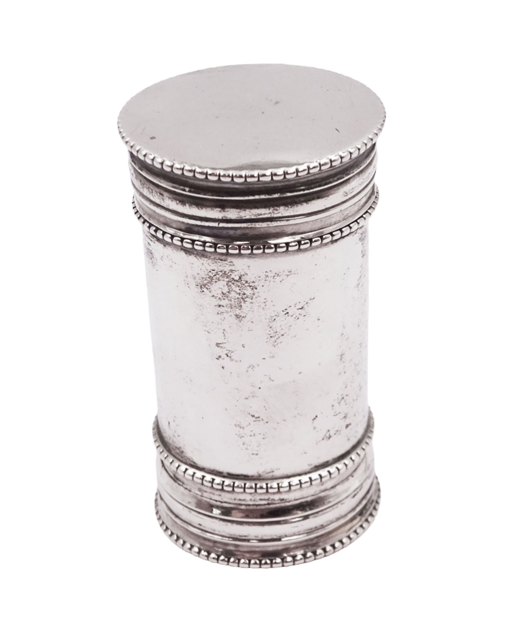 Late 19th century Dutch nutmeg grater, of plain cylindrical form with beaded rim, each end with removable silver covers with a grater to one side, with fish/dolphin mark for below 833 standard, H4.8cm